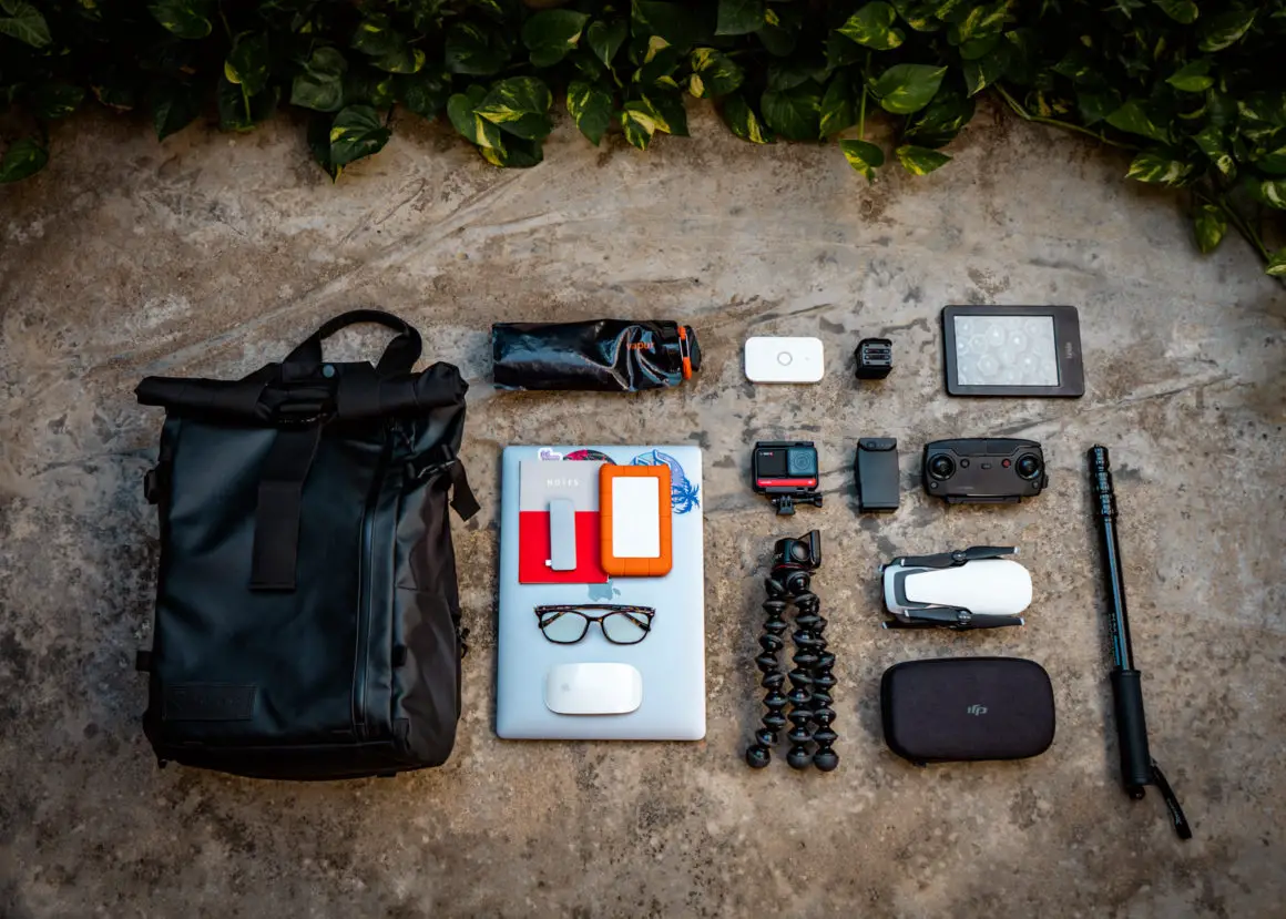 flat lay photo of travel essentials for digital nomads