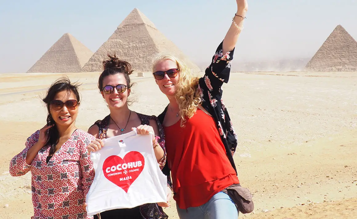 Digital Nomads posing infront of the Pyramids in Cairo, Egypt