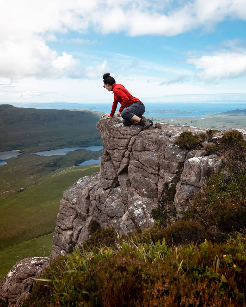 Katie sitting on the Eastern Peak of Stac Pollaidh