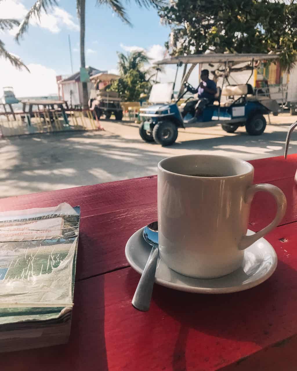 Caye Caulker for Digital Nomads (Katie sitting at a cafe)