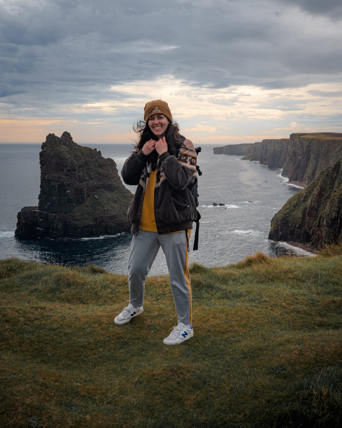 Katie standing at the Duncansby Stacks