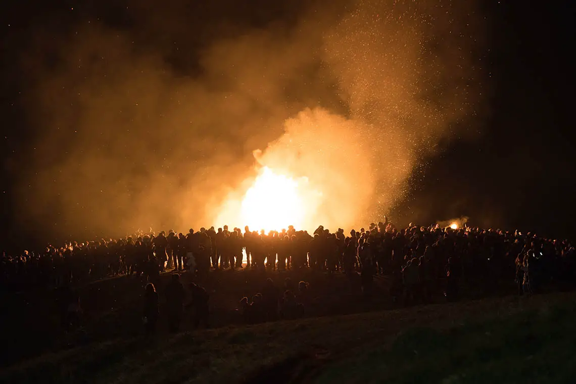 A crowd surrounding a bonfire on Guy Fawkes Night in Edinburgh.