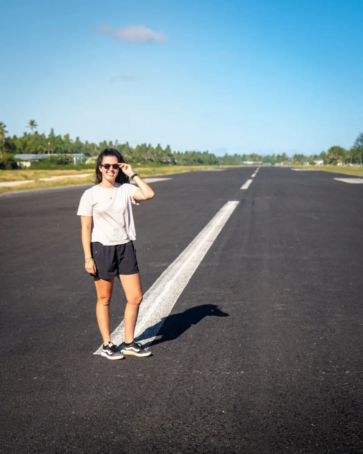 Katie standing on the Funafuti International Airport runway in Tuvalu